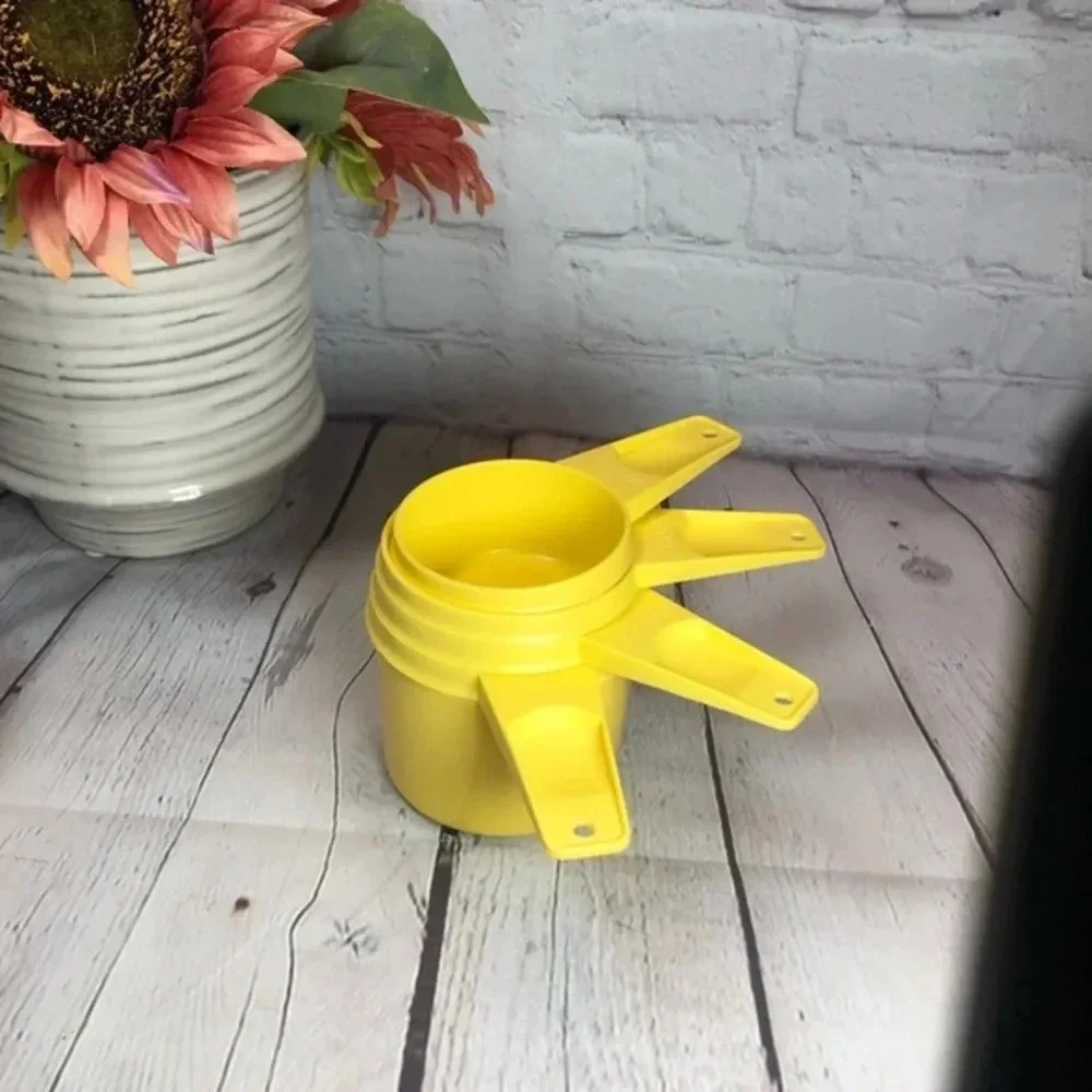 Vintage Tupperware measuring cup set yellow - not full set